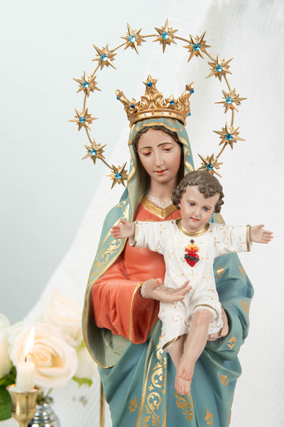 May include: A religious statue depicting the Virgin Mary holding the baby Jesus. The statue features a gold crown, a halo of stars with blue accents, and is adorned in robes of orange, blue, and gold. The baby Jesus is wearing a white robe with a red heart.