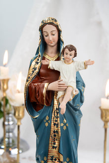 May include: A religious figurine depicting the Virgin Mary holding the baby Jesus. The statue features a blue robe with gold accents, a brown bodice, and a gold-trimmed head covering. The baby Jesus is wearing a white robe with gold trim.